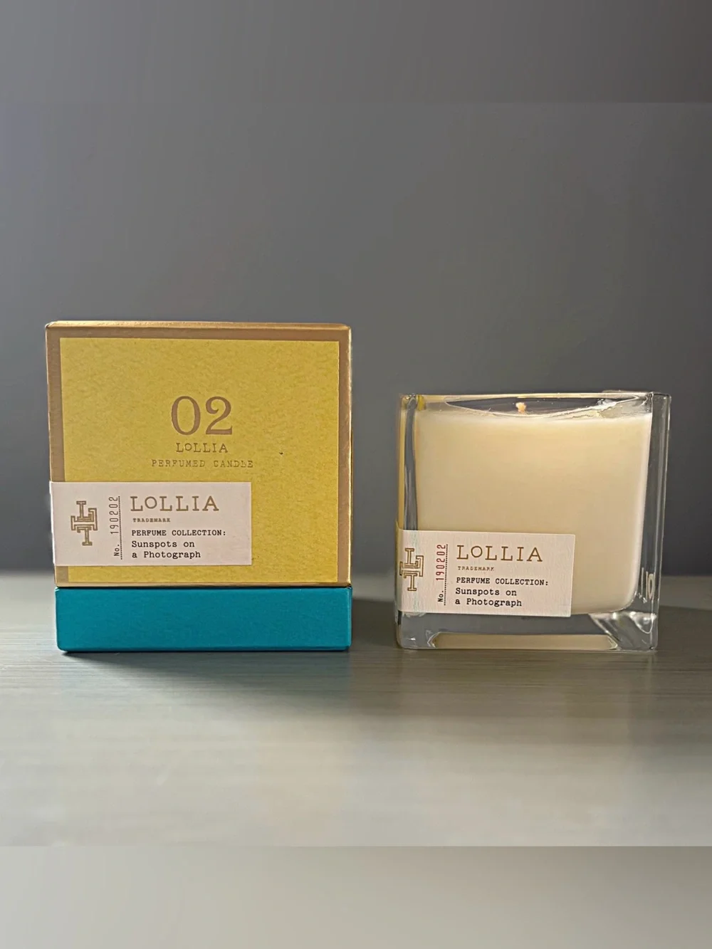 LOLLIA Poetic License Candle Margot Elena 02 Sunspots On Photograph DISCONTINUED